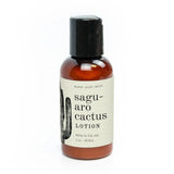 Saguaro cactus travel lotion bottle 2 oz with amber bottle, black cap, and beige label showing a cactus illustration