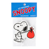 Snoopy Nomad air freshener in white with a red sack drawing packaged on a bright blue label