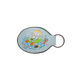 Light blue oval keychain with animals riding a raft on waves and Parks Project logo