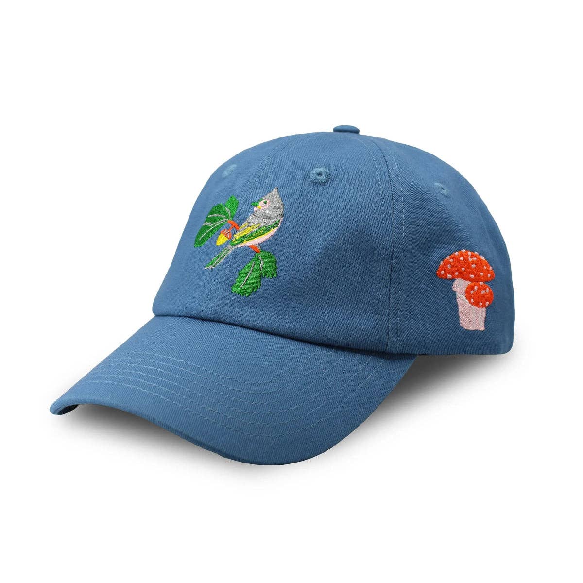 Side view of a man wearing a blue Eastern Native Flora & Fauna Hat featuring a bird and leafy plant embroidery.