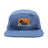 Blue camp hat with a stitched patch of a loon and orange sunrise