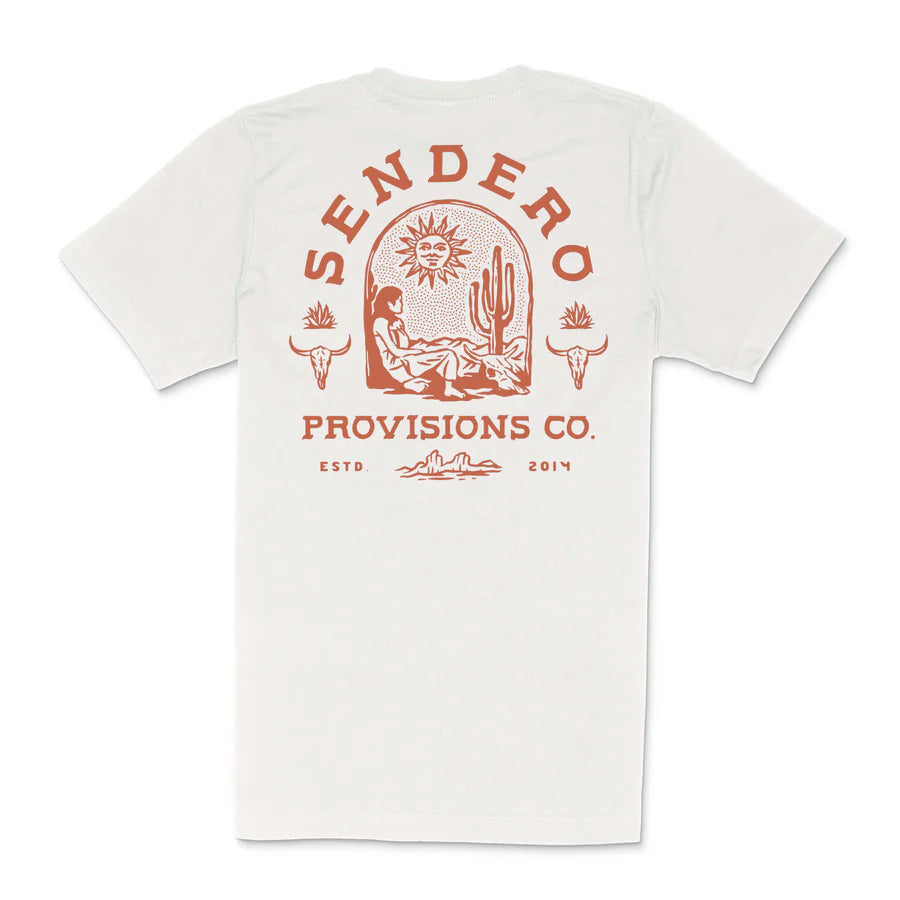 Flat lay of white De Sonora tee showing a large red desert scene graphic on the back