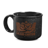 Black speckled ceramic mug with orange Grand Canyon National Park illustration.