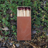 Open brown box of Grand Canyon topography matches with contour line design