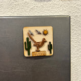Tiny Arizona wooden magnet with a desert scene of cacti and sun on a light wood plaque