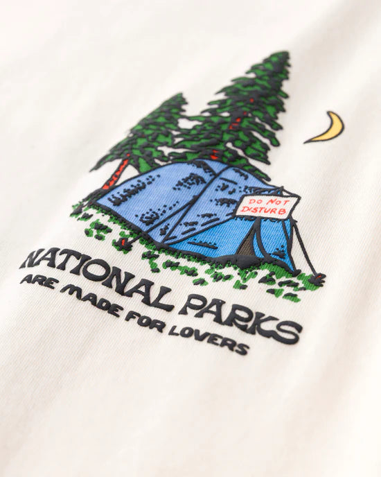 Close up of Park Lovers Tee graphic showing a blue tent among pine trees at night with a crescent moon and a Do Not Disturb sign.