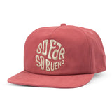 Red So Bueno flat brim hat front view with cream embroidered lettering on the crown.