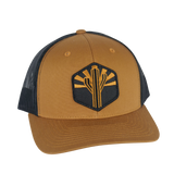 Copper Saguaro Trucker hat with tan front, black mesh, and cactus emblem patch.