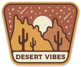 Desert Vibes sticker with cacti, orange rock formations, and a setting sun under a starry sky.