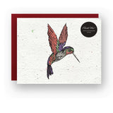 Whimsical hummingbird seed card with a colorful hummingbird illustration on speckled seed paper