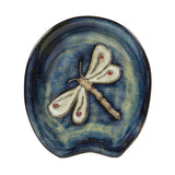 Blue ceramic spoon rest featuring a white dragonfly relief with subtle red accents.