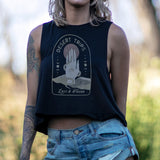 Model wearing Desert Trips Crop Tank in navy with a vintage praying hands graphic