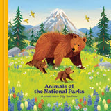 Illustrated cover of Animals of the National Parks showing a bear and cubs in a snowy mountain meadow with pine trees.