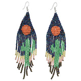 Pair of triangular beaded fringe earrings in blue orange green and cream colors.