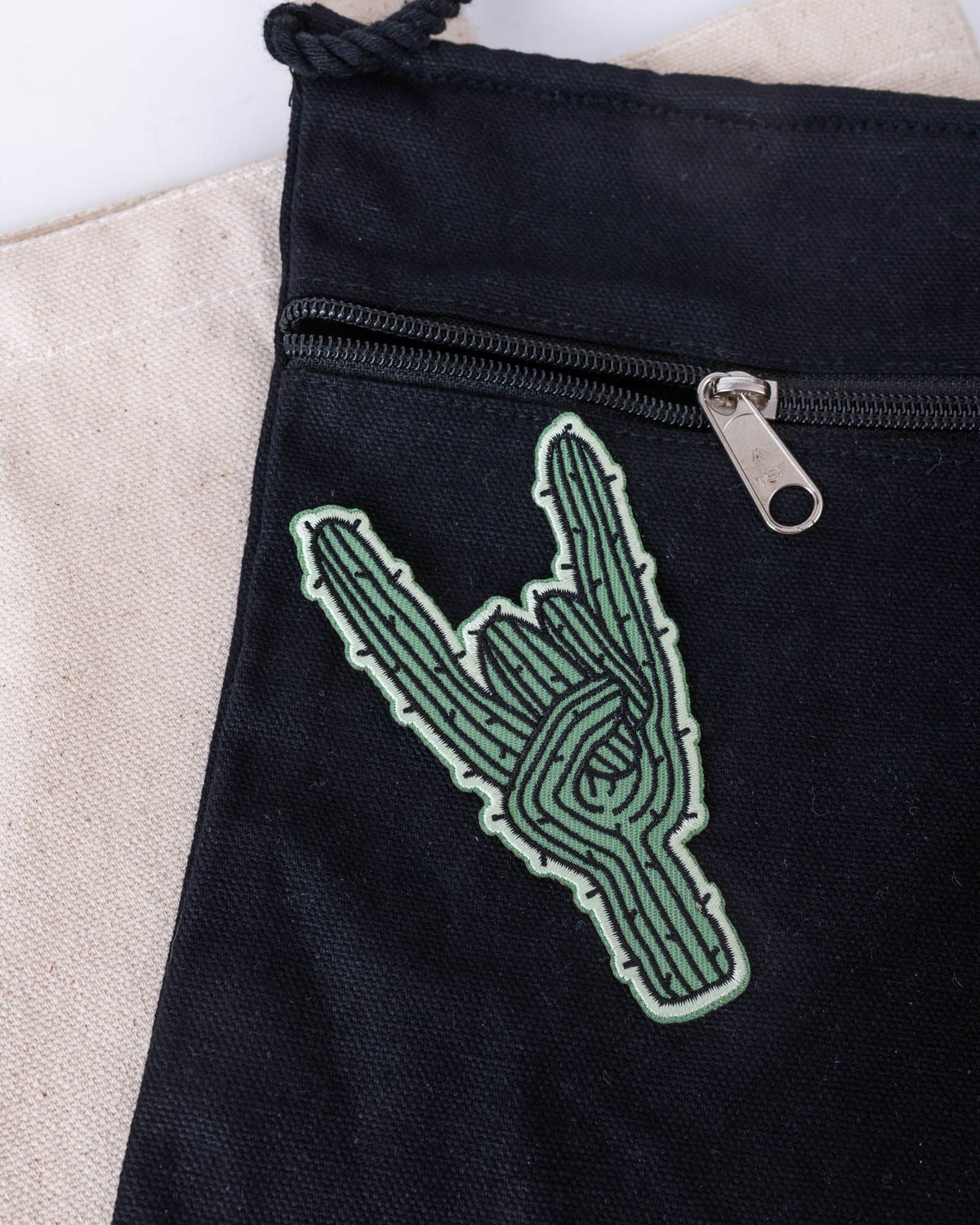 Rockin’ Saguaro Patch placed on dark fabric with embroidered cactus detail