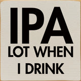 Beige square wall sign with bold black text reading IPA LOT WHEN I DRINK.