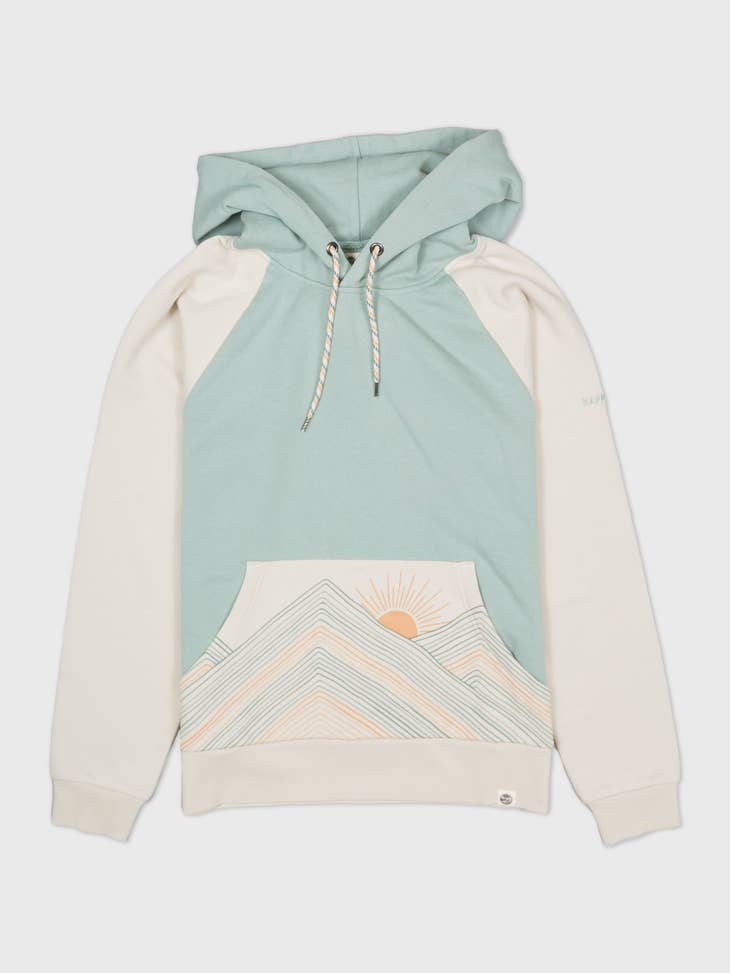 Pastel rainbow mountains hoodie with teal body cream sleeves and a sunlit mountain graphic on the front pocket