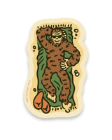 Squatch lounging inside a green sleeping bag on a camping sticker