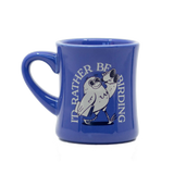 Blue ceramic mug with a white bird illustration and the text I'd Rather Be Birding wrapped around it