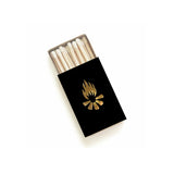 Black campfire matchbox with a gold flame emblem and exposed matches.