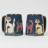 Two square ceramic mugs with cat illustrations on a white background