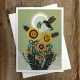 Be Born Slowly greeting card featuring sunflowers and a hummingbird against a green background