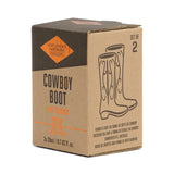 Boxed set of two Cowboy Boot shot glasses on kraft packaging with boot illustration.