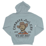 Light blue hoodie shown from the back with a large circular Cowboys Don't Cry logo and cowboy illustration.