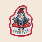 Gnomaste patch featuring a bearded gnome sitting on a red mushroom with white spots