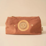 Pink corduroy zip pouch with a circular sun motif and cactus embroidery on the front