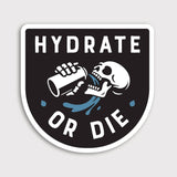 Hydrate or Die sticker with a white skeleton drinking from a bottle on a black shield