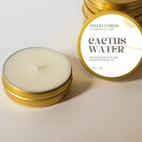 Cactus Water 1.7 oz travel candle in a gold tin with a white label