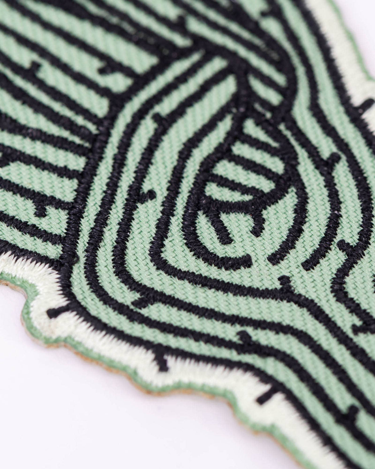 Rockin’ Saguaro Patch stitched to a black bag near the zipper