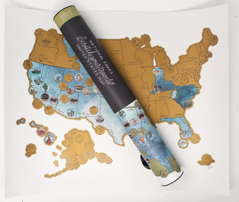 63 US National Park scratch-off map rolled over a printed United States map.