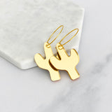 Gold cactus shaped dangle earrings with curved ear wires
