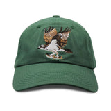 Close-up of green cap with detailed embroidery of an osprey on the front panel
