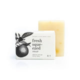 Fresh Squeezed Natural Bar Soap with white wrapper featuring a citrus illustration and a pale yellow soap bar
