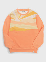 Sunburst Crewneck Pullover in peach with pastel sunburst stripes across the chest