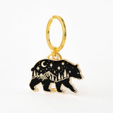 Gold bear shaped keychain with black enamel featuring a starry night and mountains