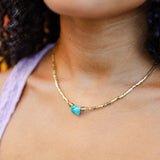 Golden Touch Choker with tiny gold beads and a turquoise centerpiece