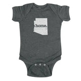 Dark gray baby onesie featuring a white Arizona silhouette and home text on the chest.