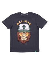 Clyde the Squatch youth tee in dark navy with a cartoon ape wearing a pine tree cap and BELIEVE arched above.