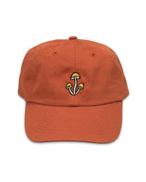 Orange Shroom Dad Hat with embroidered mushroom cluster logo.