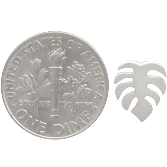 Monstera leaf stud earring shown next to a dime for scale in recycled sterling silver