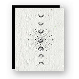Moon Phases Seed Card displaying a vertical sequence of lunar phases with a central celestial diagram on textured paper