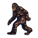 Sasquatch Patch showing a walking Bigfoot with dark fur and warm brown highlights.