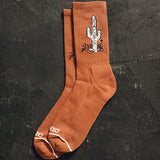 Orange cactus Taco crew socks with a white cactus graphic.