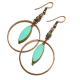 Copper hoop earrings featuring turquoise oval planet charms with green accent beads