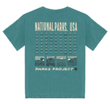 Back view of teal National Park Fill In Tee with a grid of park icons and PARKS PROJECT label