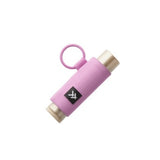Pink fabric lip balm holder with gold end caps and attached pink loop.